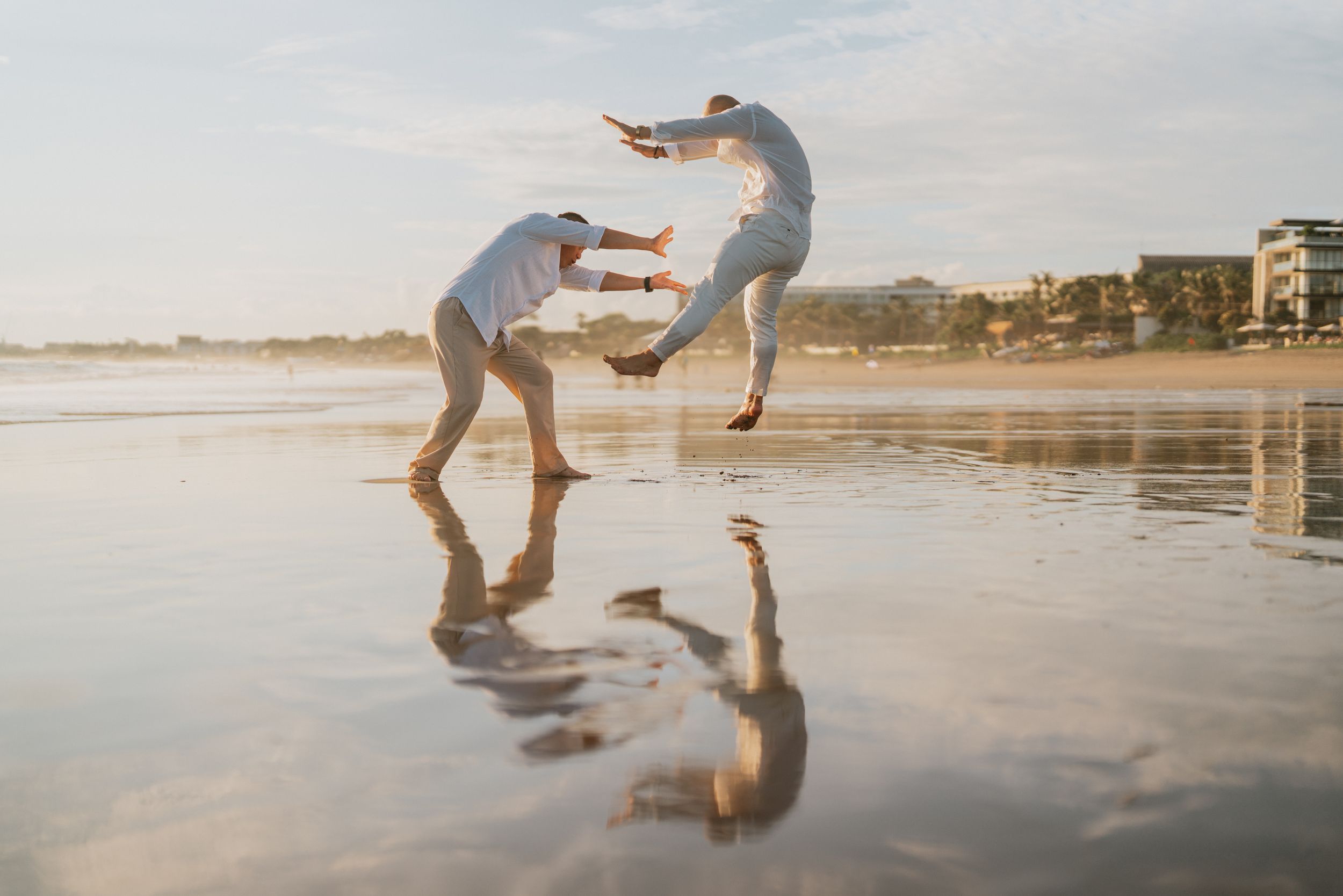Beach family photography in Bali with an 
ocean backdrop
