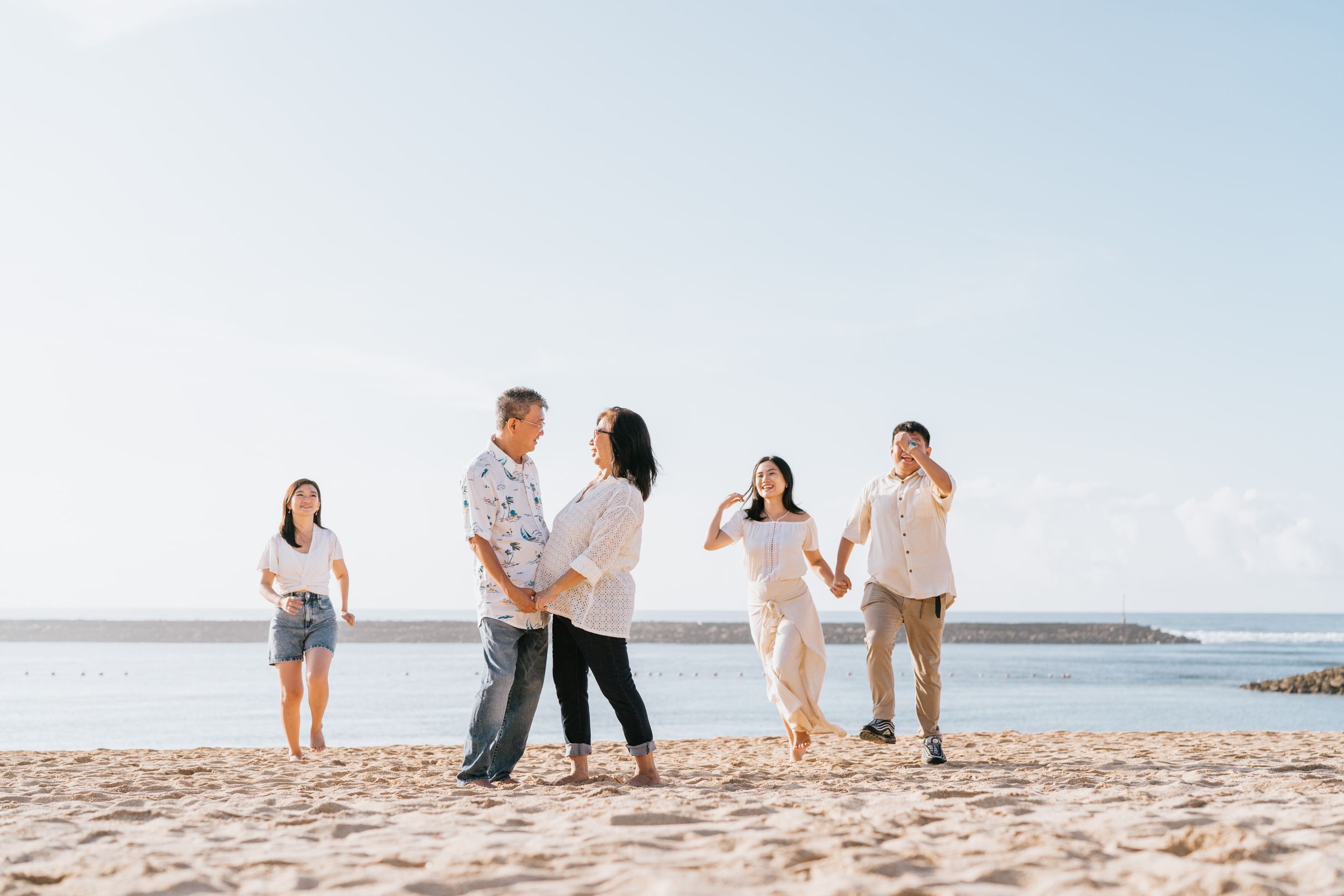 Professional family photoshoot at The Apurva Kempinski Bali’s beachfront area.