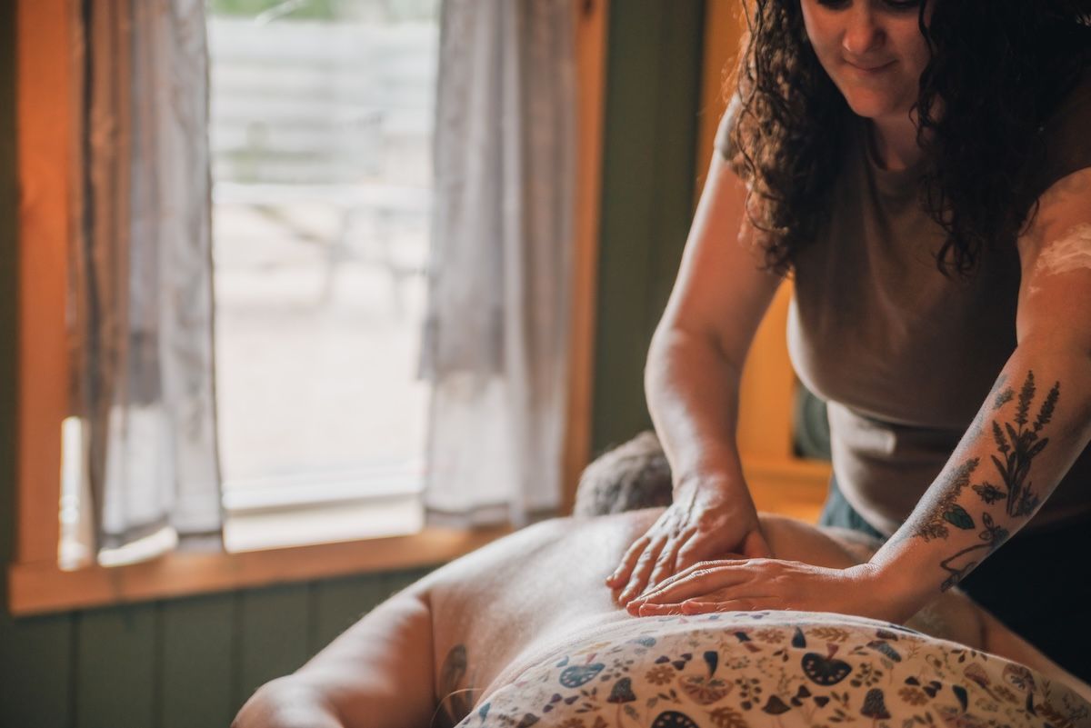masseuse massages a back