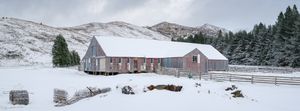 old shearing wool shed covered in snow in the Canterbury high country