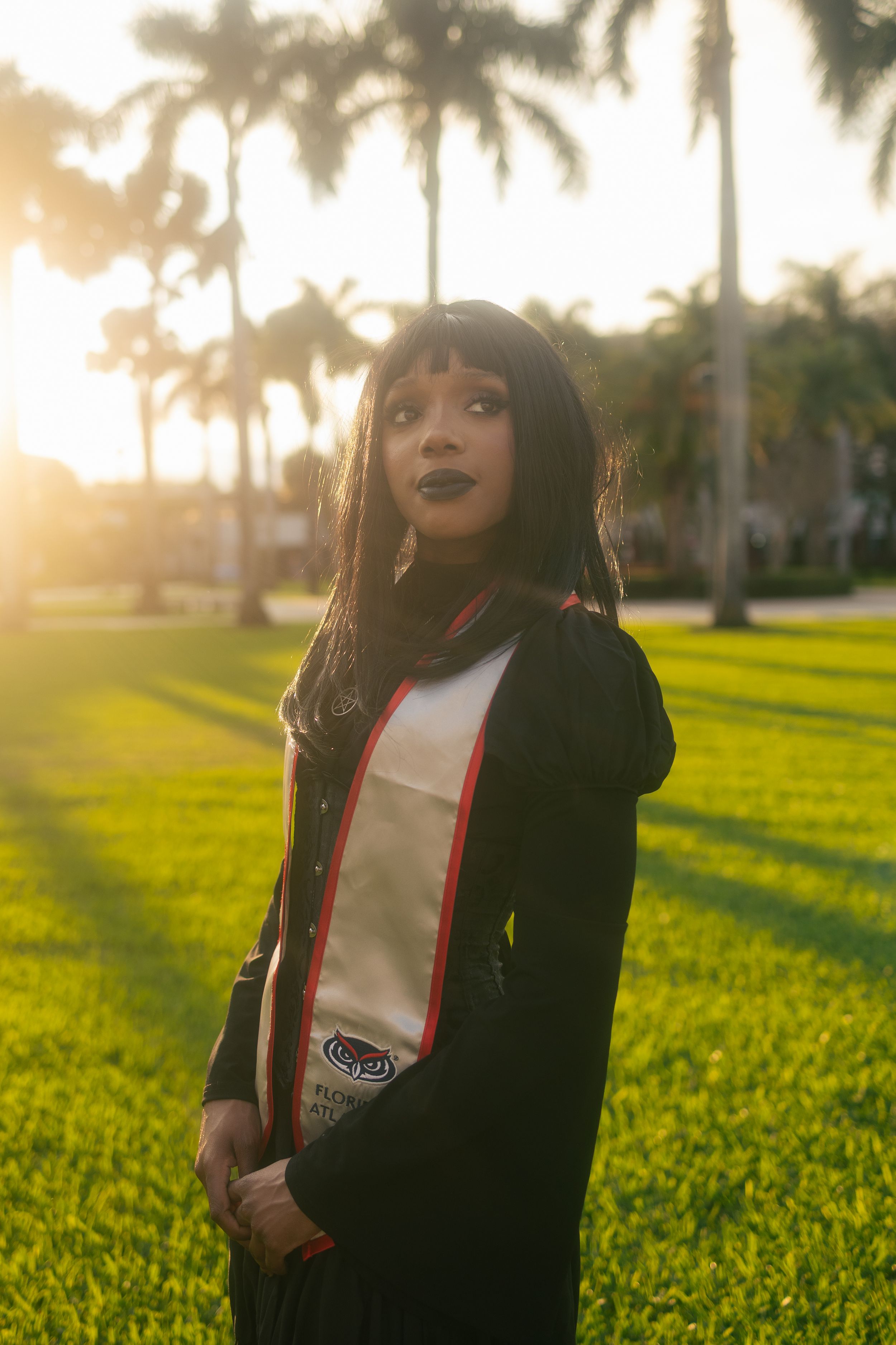 Golden hour graduation photoshoot in Fort Lauderdale with palm trees. UM senior photography by MannyPortraits.
