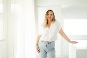Collage of someone posing in casual light blue skinny jeans and white tops against a bright white background.
