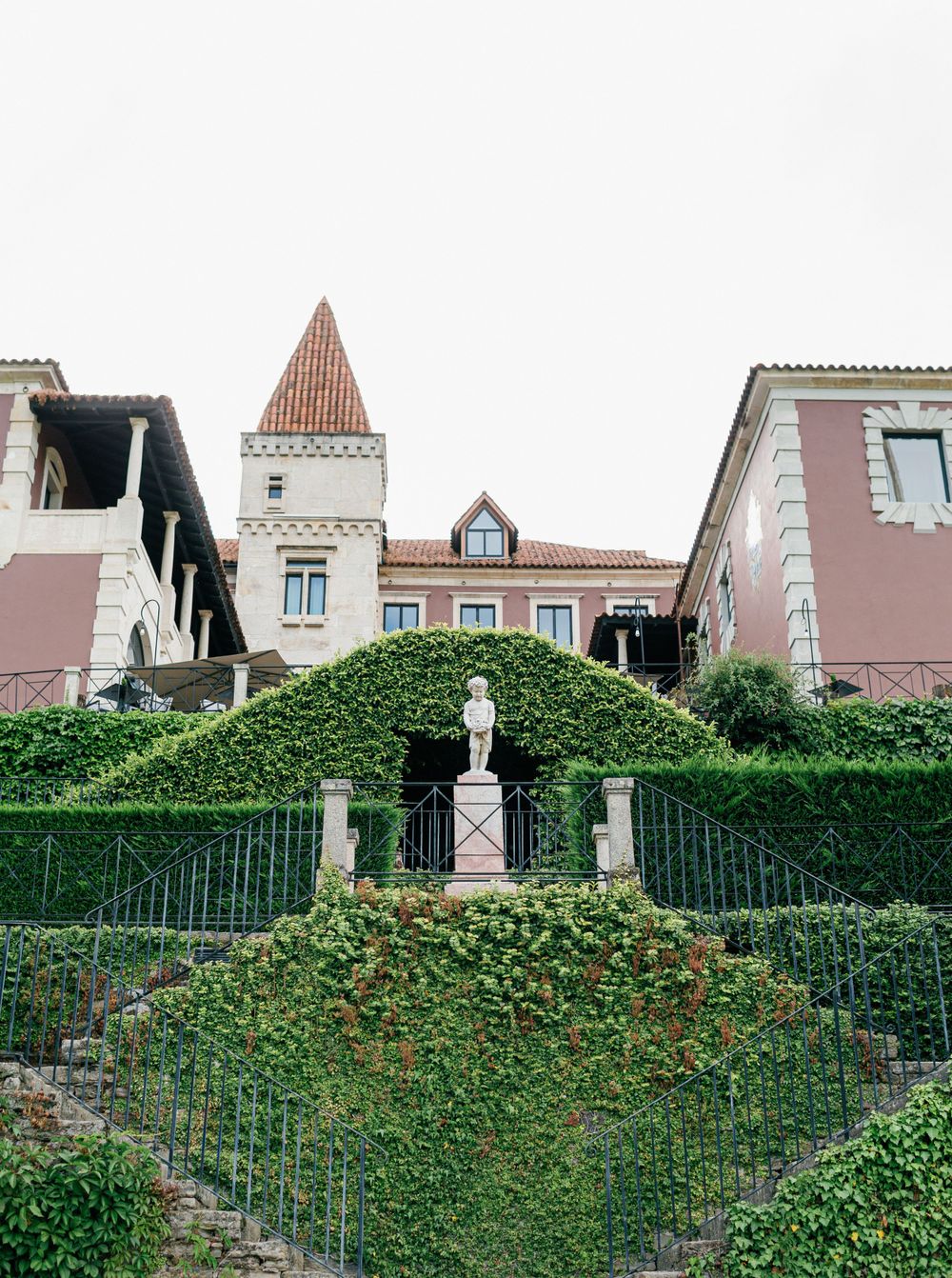 Elegant exterior view of Six Senses Douro Valley, showcasing ivy-covered walls and classic architecture.