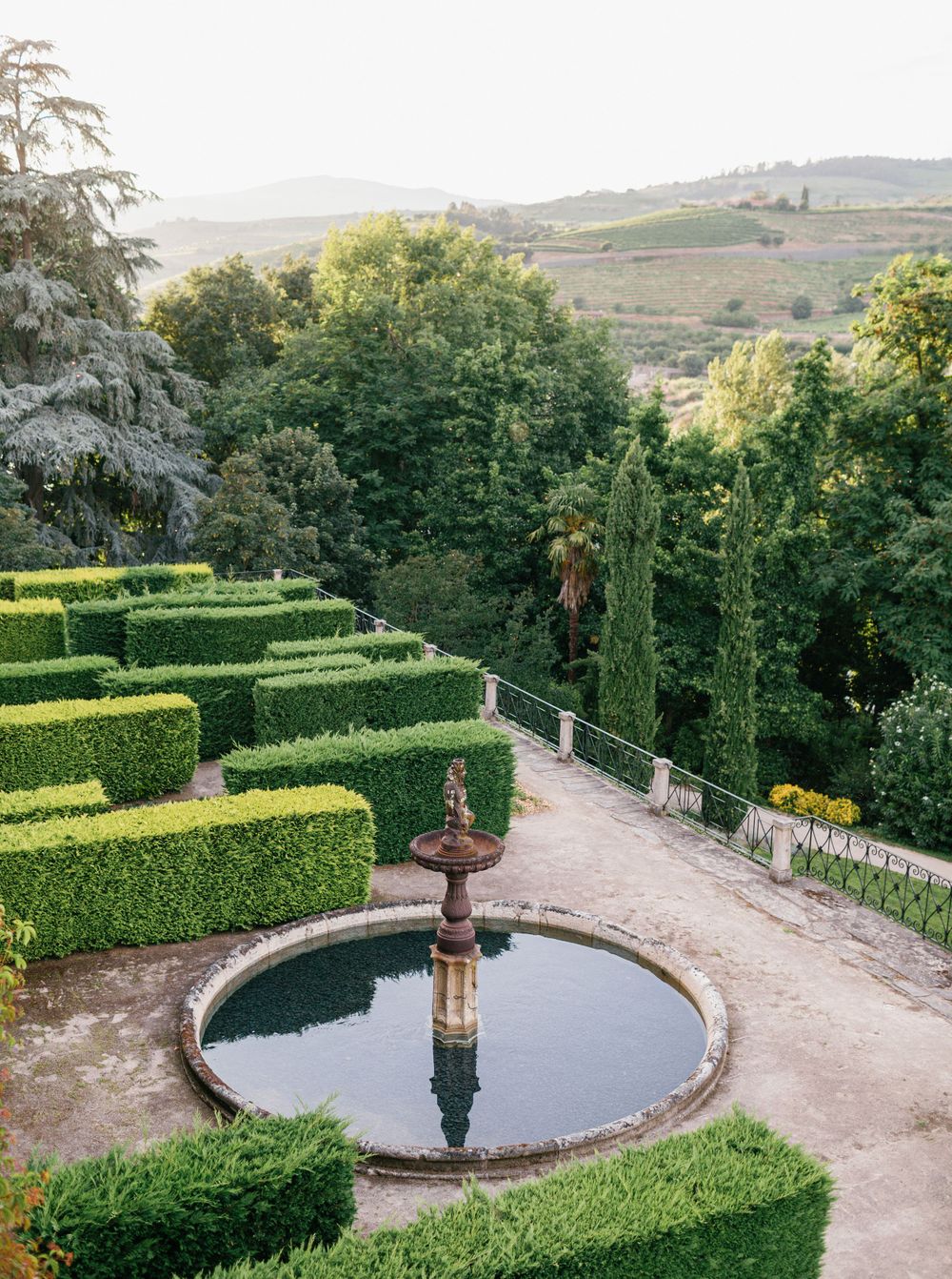 Overlooking the lush Douro Valley vineyards from the garden at Six Senses, with a beautifully manicured landscape.