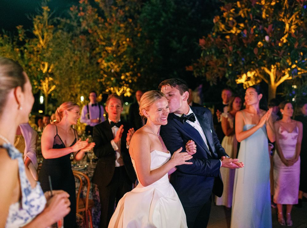 Joyful couple celebrating their wedding with loved ones on the dance floor, Six Senses Douro Valley.