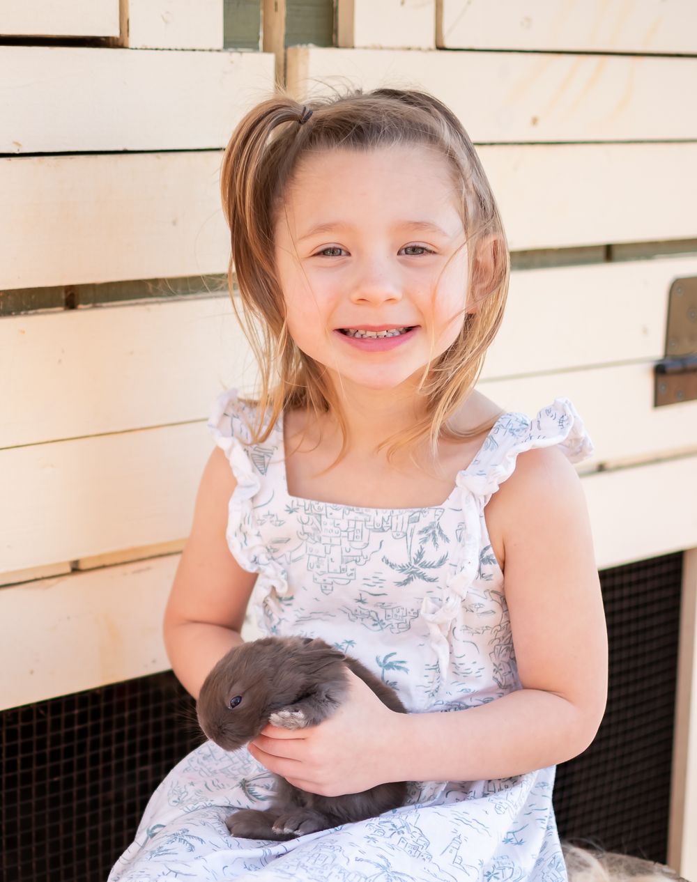 child posed with a bunny for a easter themed photo session