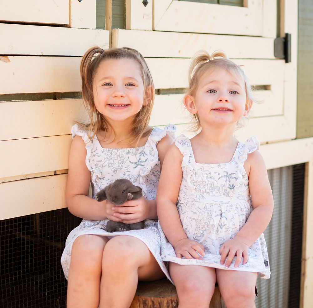 two children posed with a bunny for a easter themed photo session