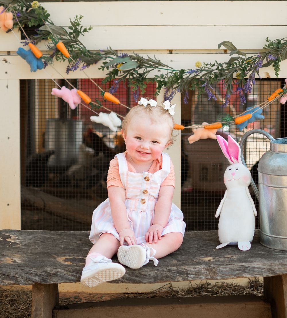 child posed with a bunny for a easter themed photo session