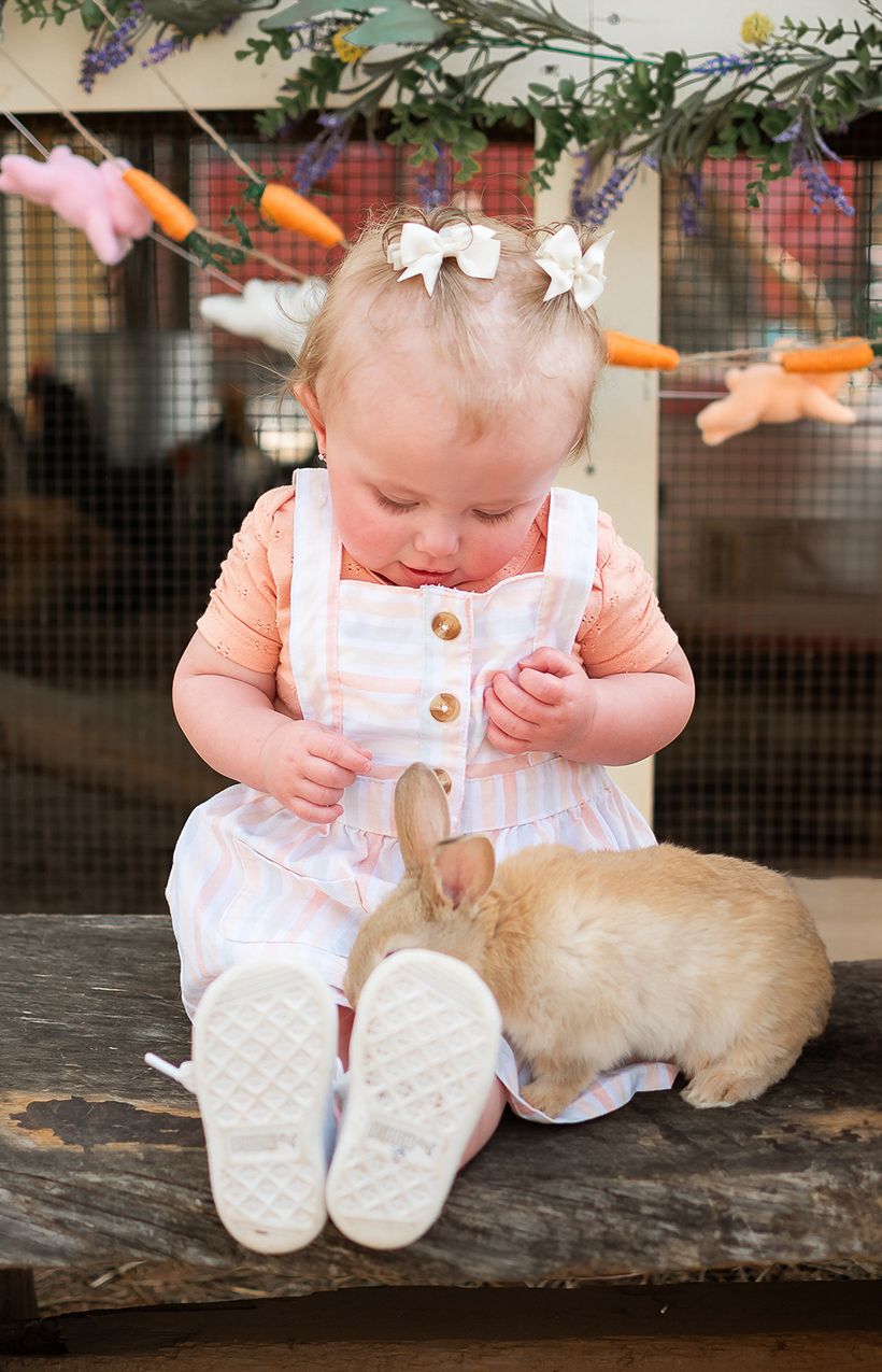 child posed with a bunny for a easter themed photo session