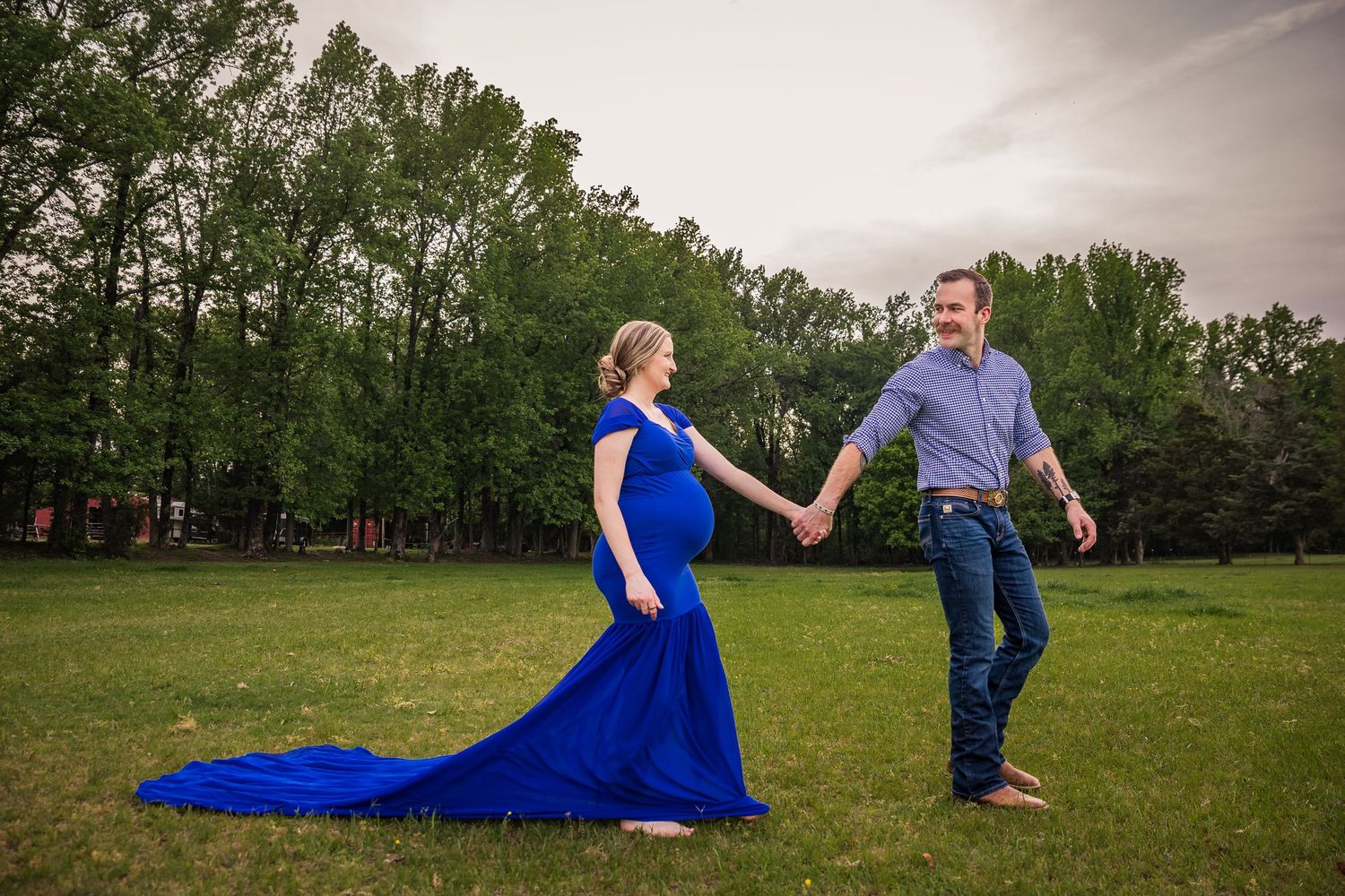 Maternity Session. Mom and dad walking together awaiting a new arrival.