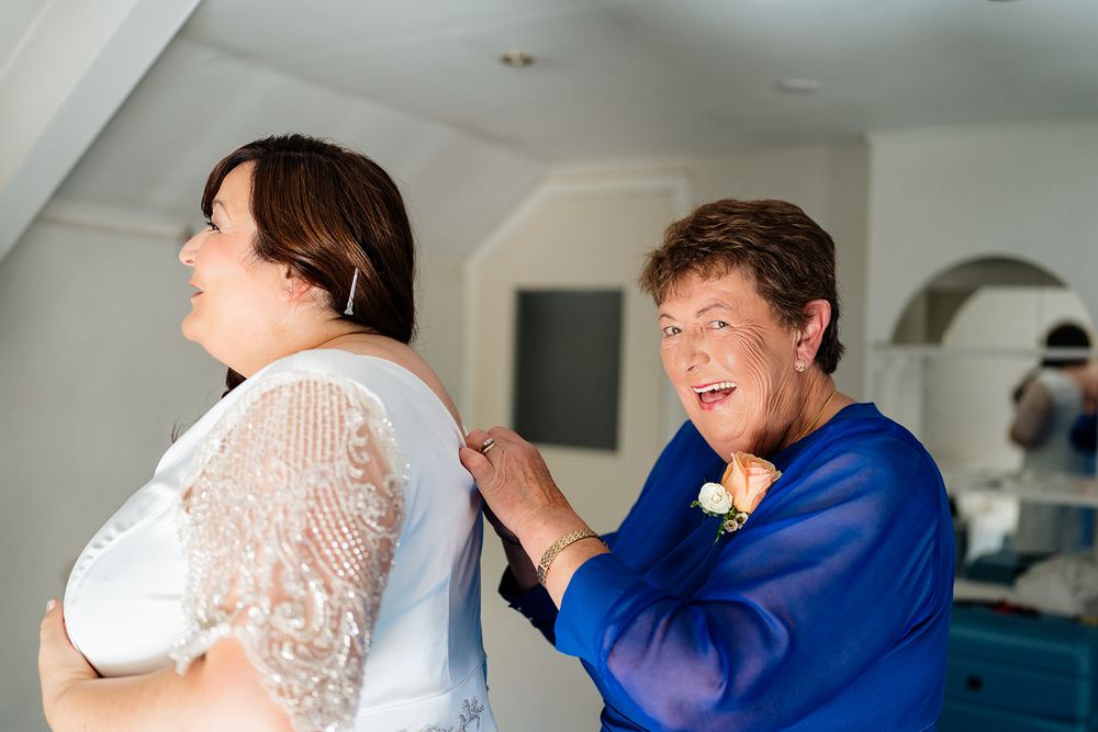 Sequence of candid moments at a wedding celebration shows expressions of joy and laughter between the couple and guests.