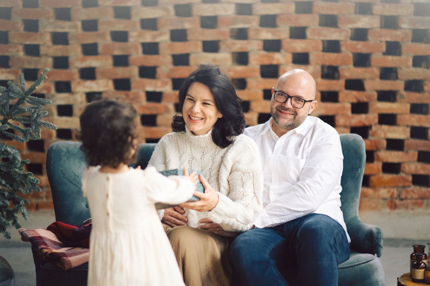 People having a conversation while sitting together on comfortable seating in a casual meeting space.