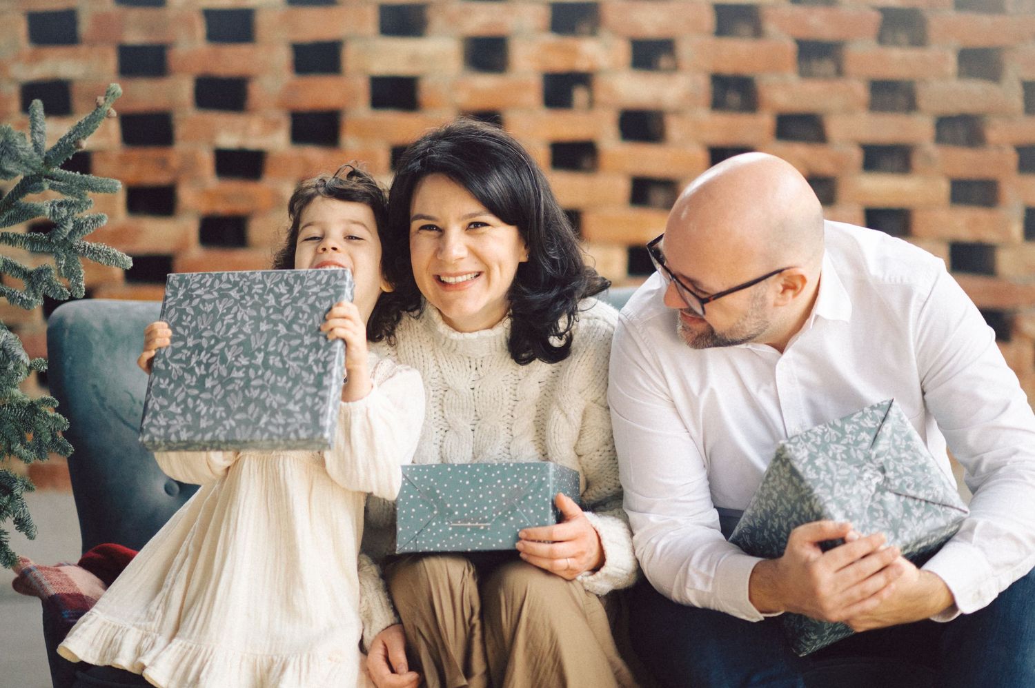Three intimate engagement photos in vintage style showing couple laughing outdoors near brick wall.