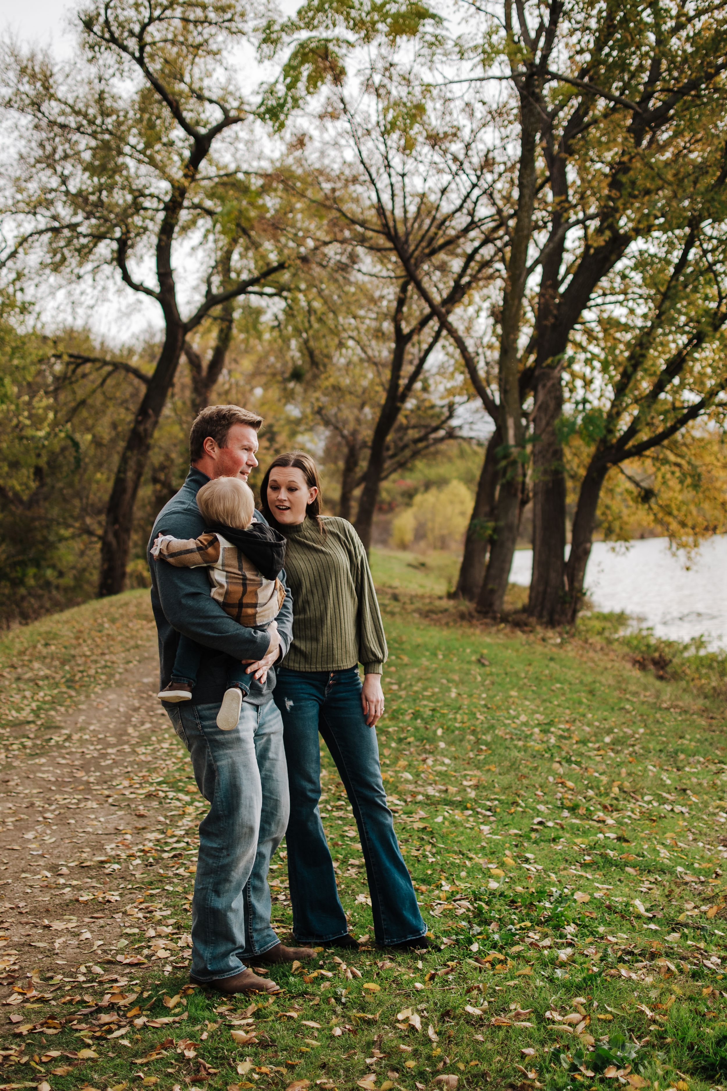 Candid family moment in winter light at Fort Worth park photography session