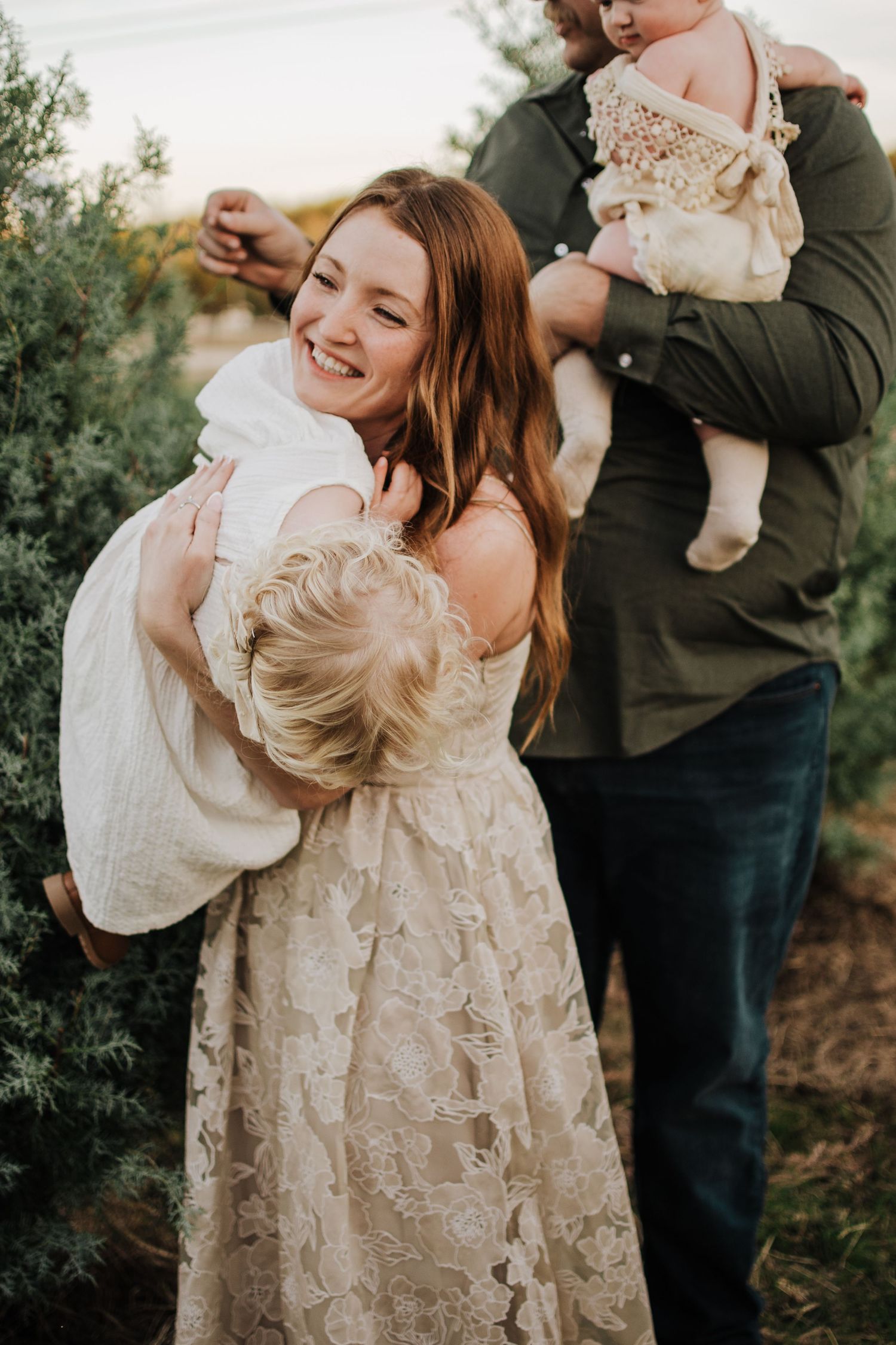 Dfw Tree Farm Joyful family moment captured in a series of candid shots outdoors with natural greenery.