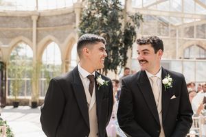 Beautiful conservatory wedding ceremony space filled with natural light and architectural details.