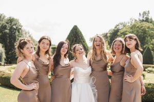 Wedding party photos outdoors with bridesmaids wearing matching brown dresses.