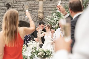 Wedding guests celebrating with sparklers creating a magical evening atmosphere.