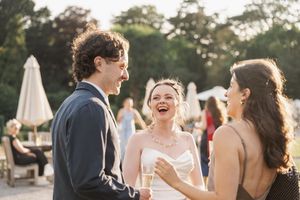 Candid outdoor wedding moments captured during golden hour with natural lighting.