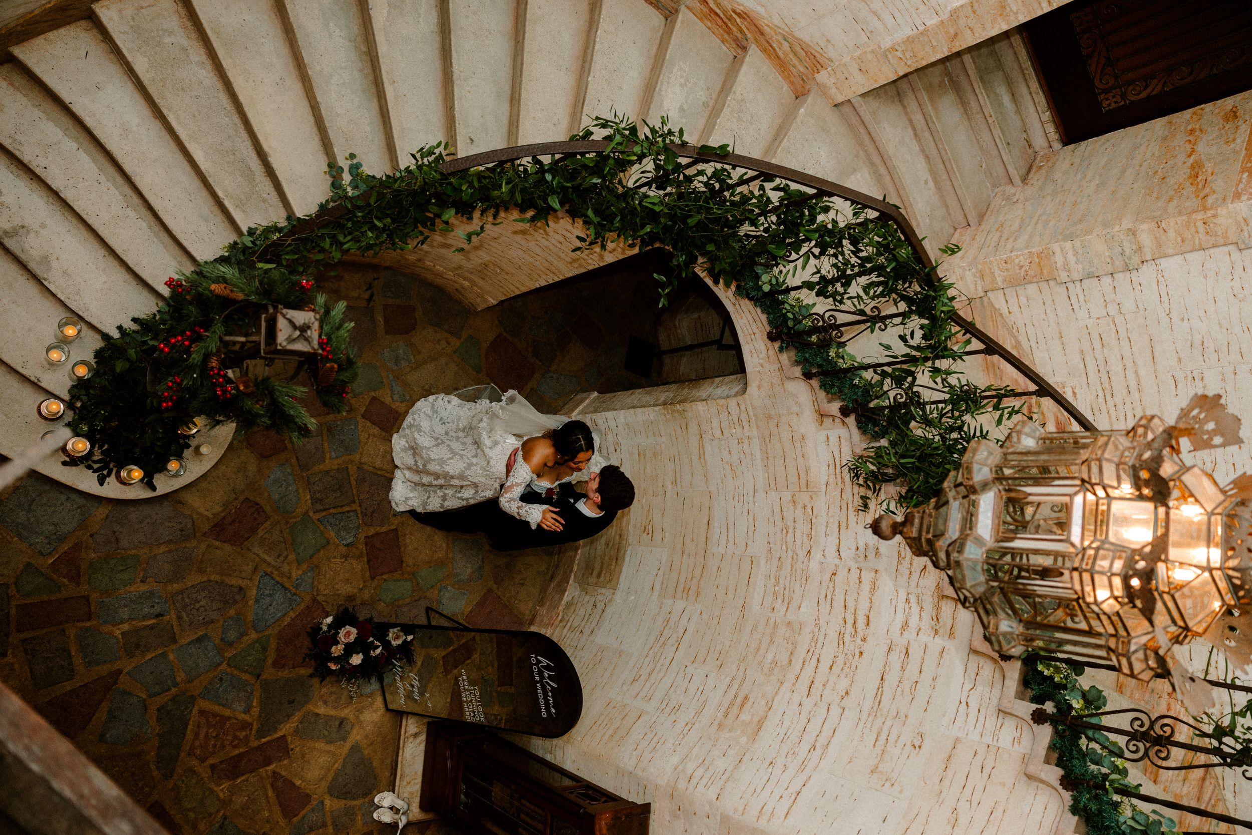 Moody cinematic picture of bride and groom at staircase at the Howie mansion in florida