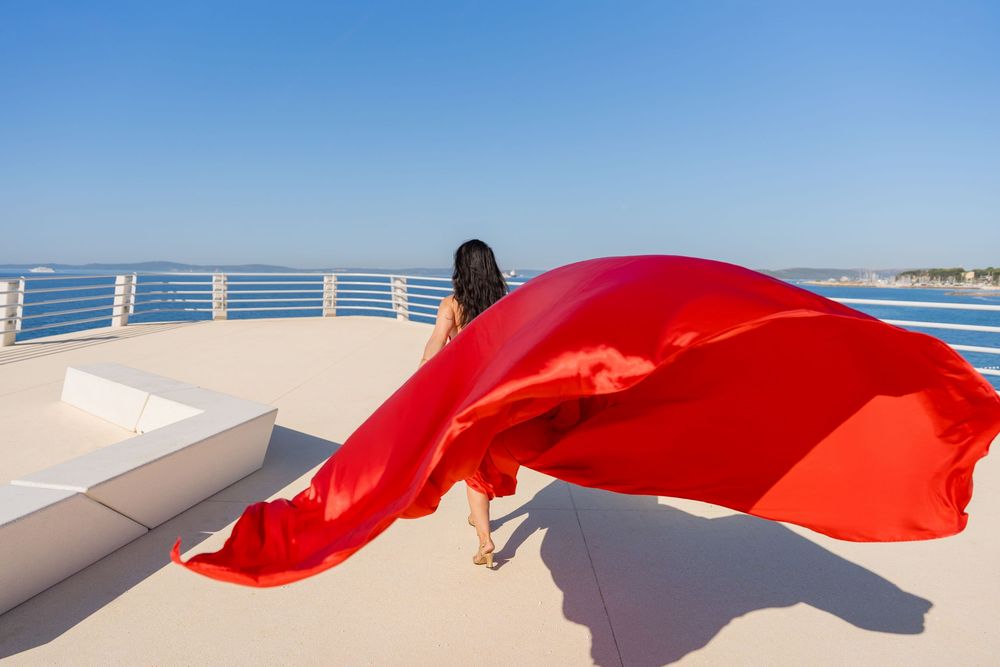 Znjan Beach Split Red Flying dress Croatia SPLIT PHOTO AGENCY