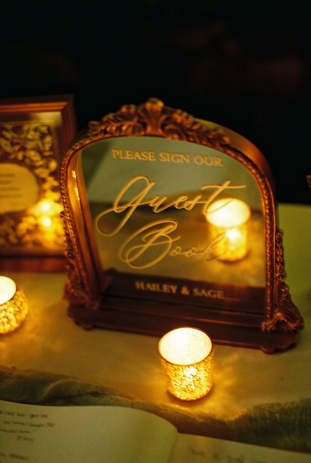 A film guest book detail photo on film showcases soft lighting and wedding photography details.