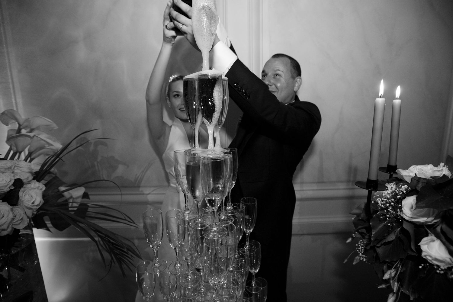 champagne tower moment during luxury wedding reception in France