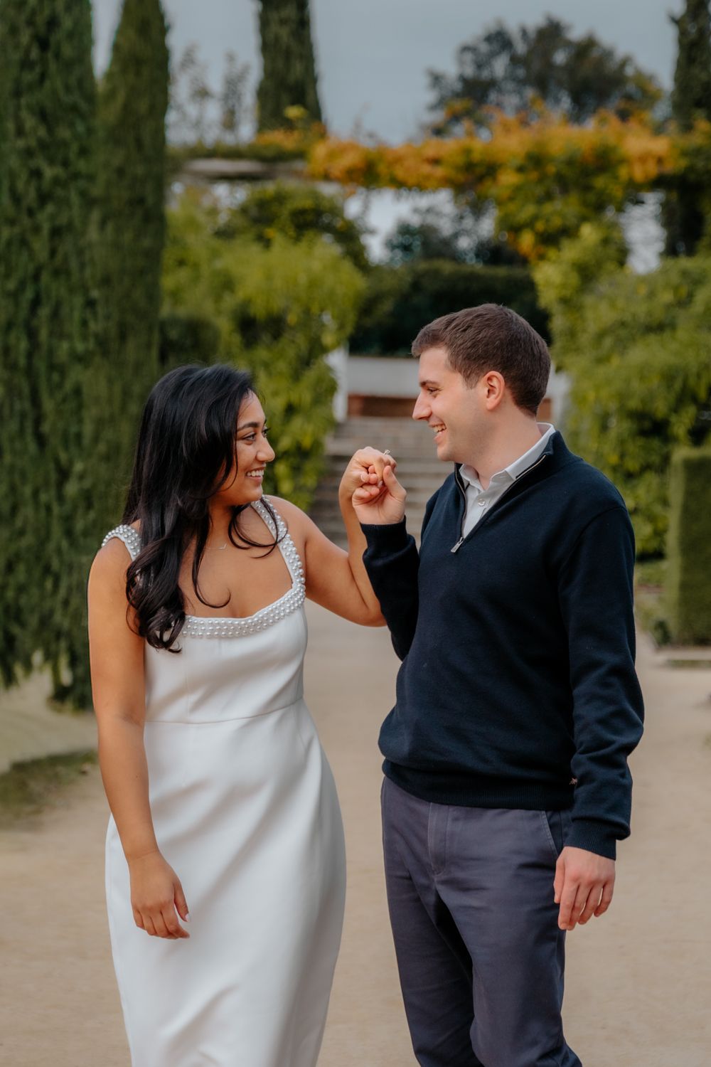 Walking candid moment through Teatre Grec gardens Surprise proposal photoshoot Barcelona BarcelonaLoversPH