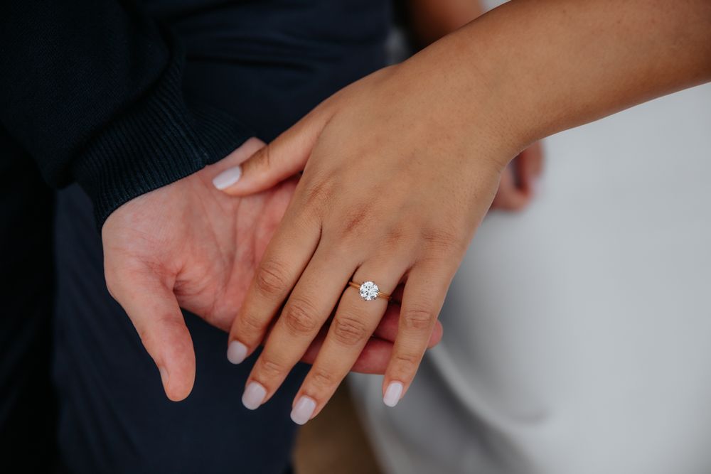 Lewis whispering before proposal in Montjuïc gardens Barcelona proposal photographer BarcelonaLoversPH