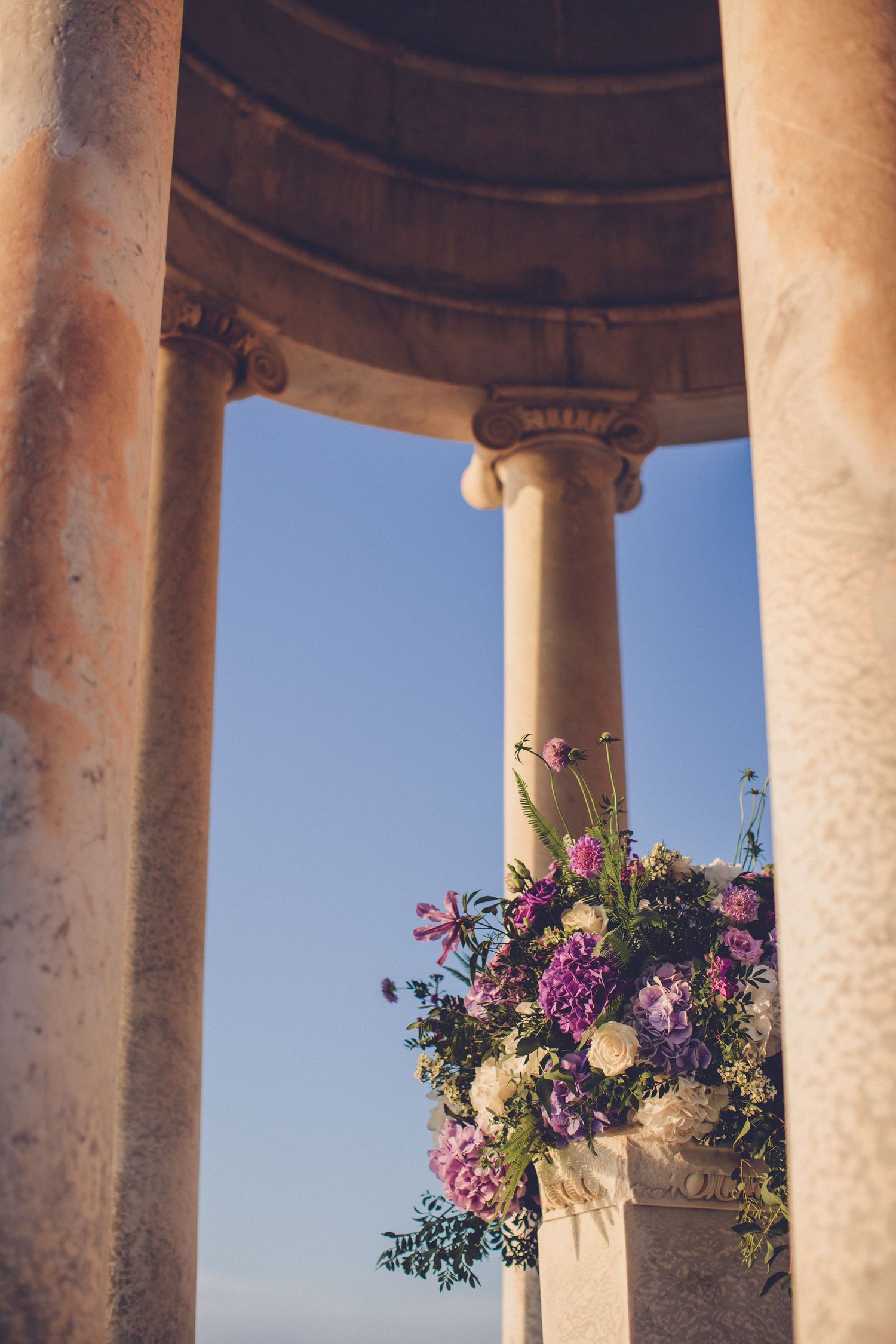 Floral ceremony arrangement inside the marble temple at Son Marroig wedding venue in Mallorca