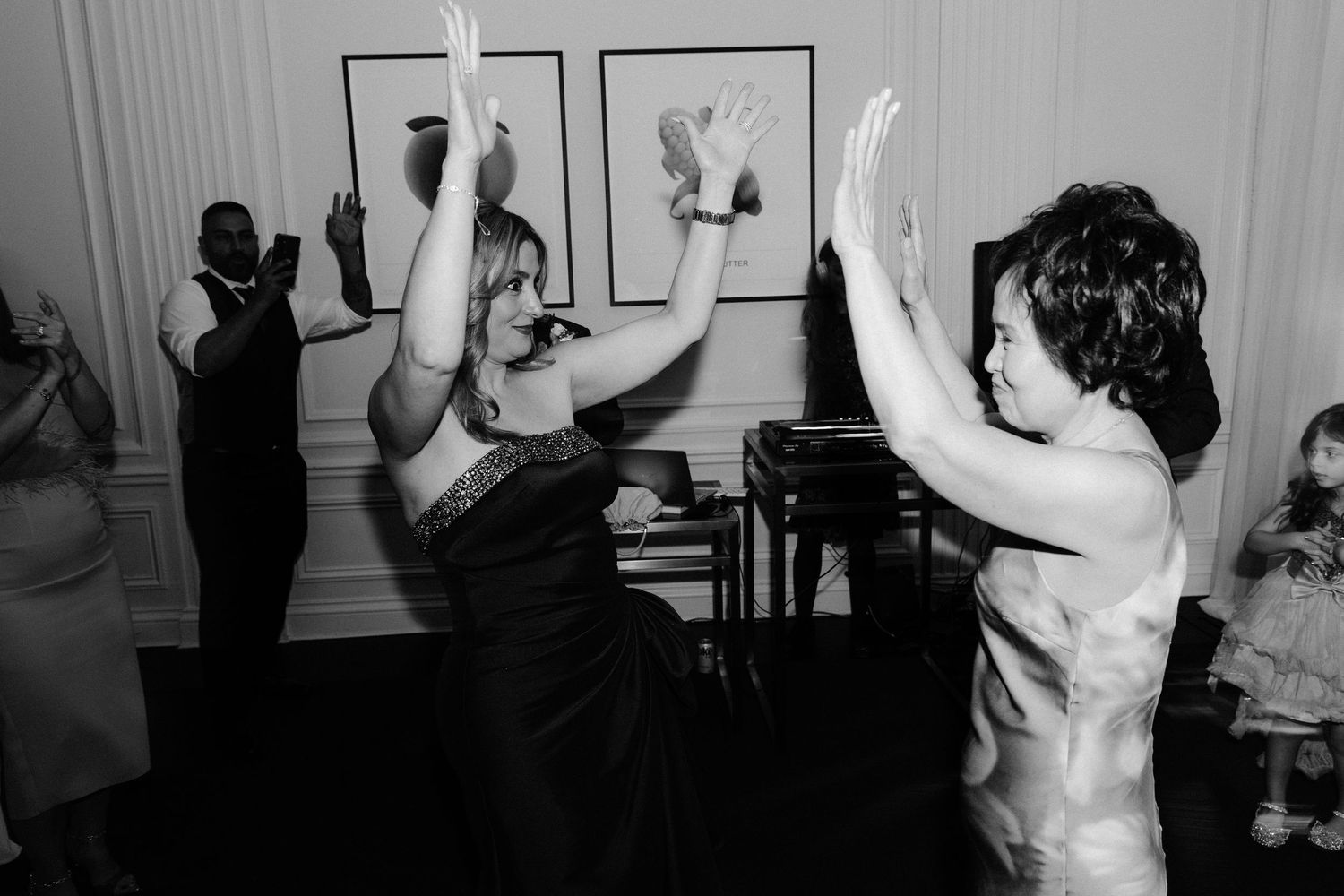 A series of black and white dance photos showing graceful movement and expressive poses during a performance.