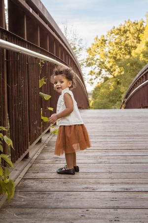 Outdoor Family Session toddler girl on bridge