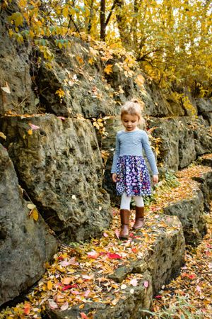 Outdoor Fall Family session girl walking on rocks