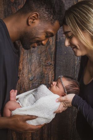 Newborn baby with new parents
