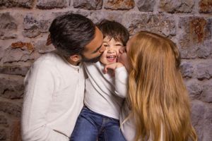 Greater Toronto Area Family Photographer  parents kissing toddler cheeks