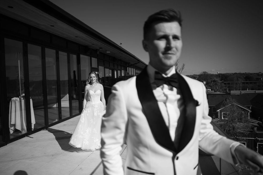 A black and white photo montage showing a person in formal attire at different angles and poses.