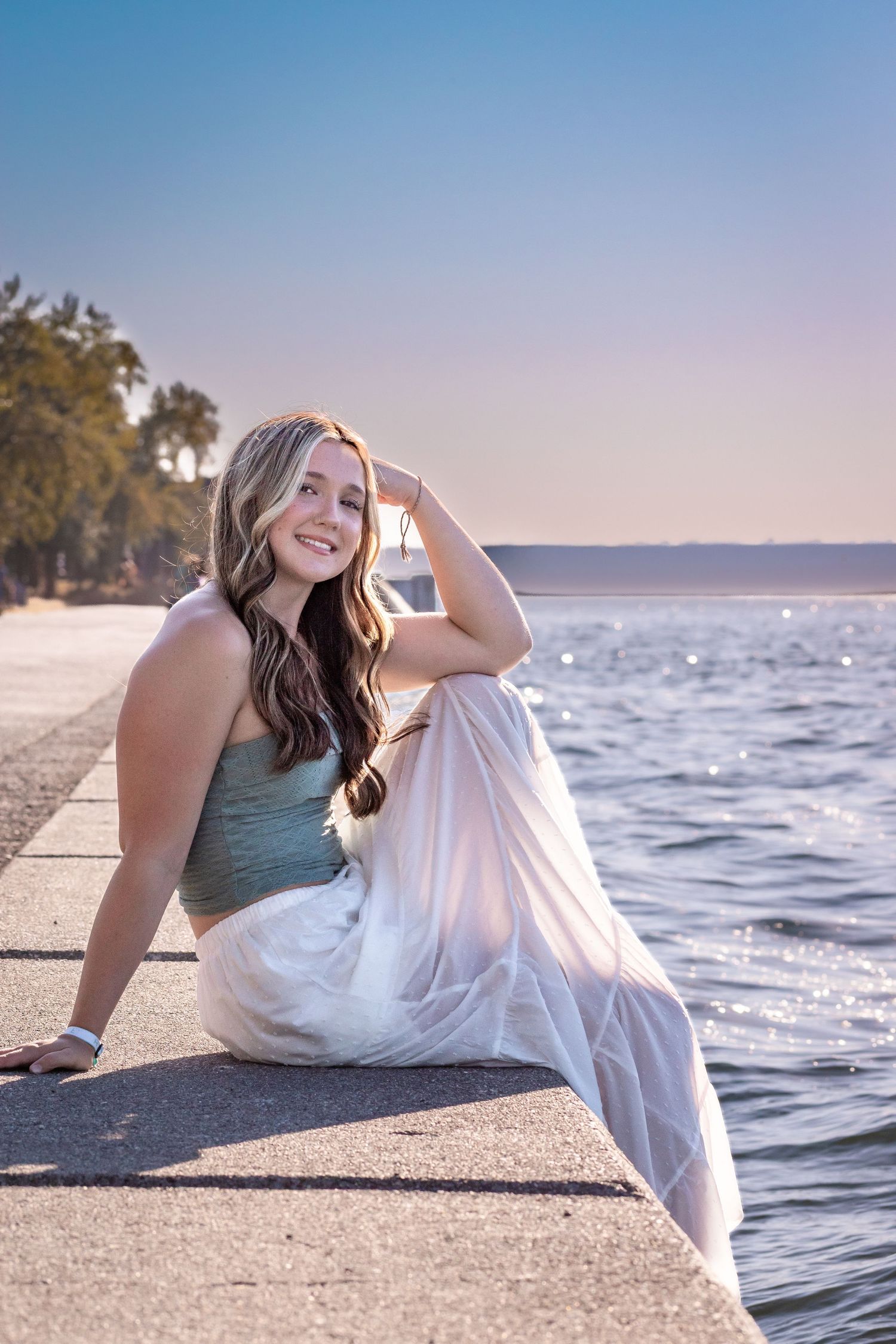 Seattle senior graduation portrait at Alki Beach in Seattle, Washington with waterfront background