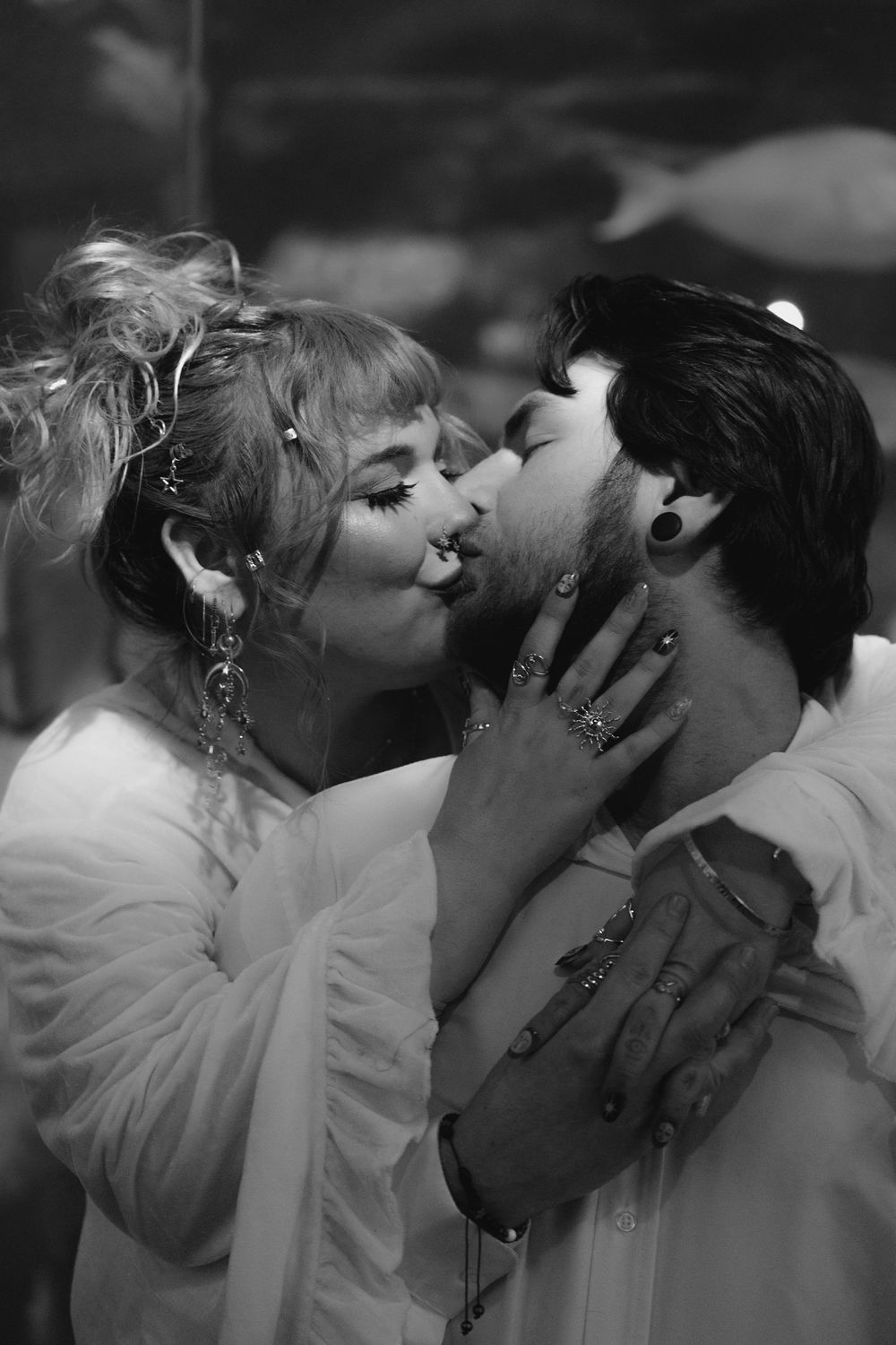 A series of black and white romantic photographs showing tender moments between a couple.