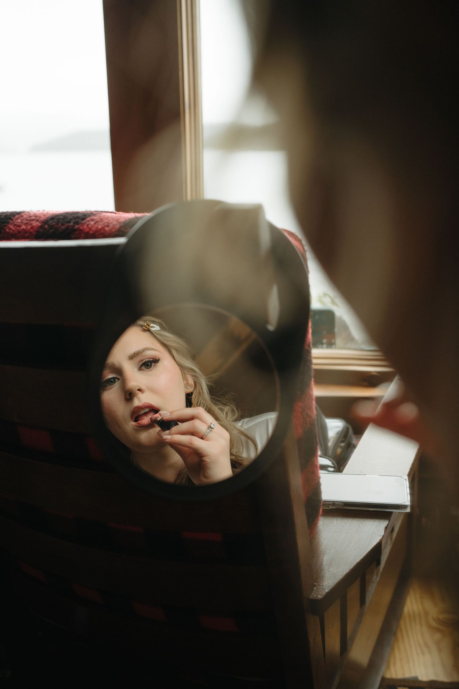 Artistic portrait series with moody lighting and reflective surfaces creating a dramatic atmosphere.