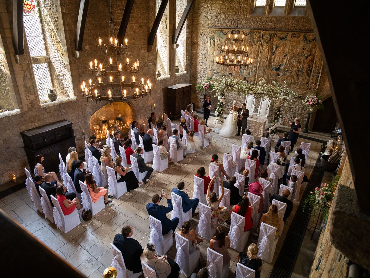 Wedding ceremony photographed from balcony inside the medieval Great Hall at Allington Castle