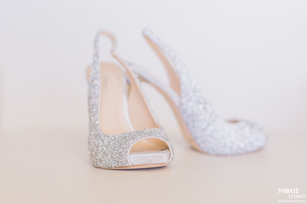 Sparkly silver wedding heels with crystal embellishments displayed in multiple angles.