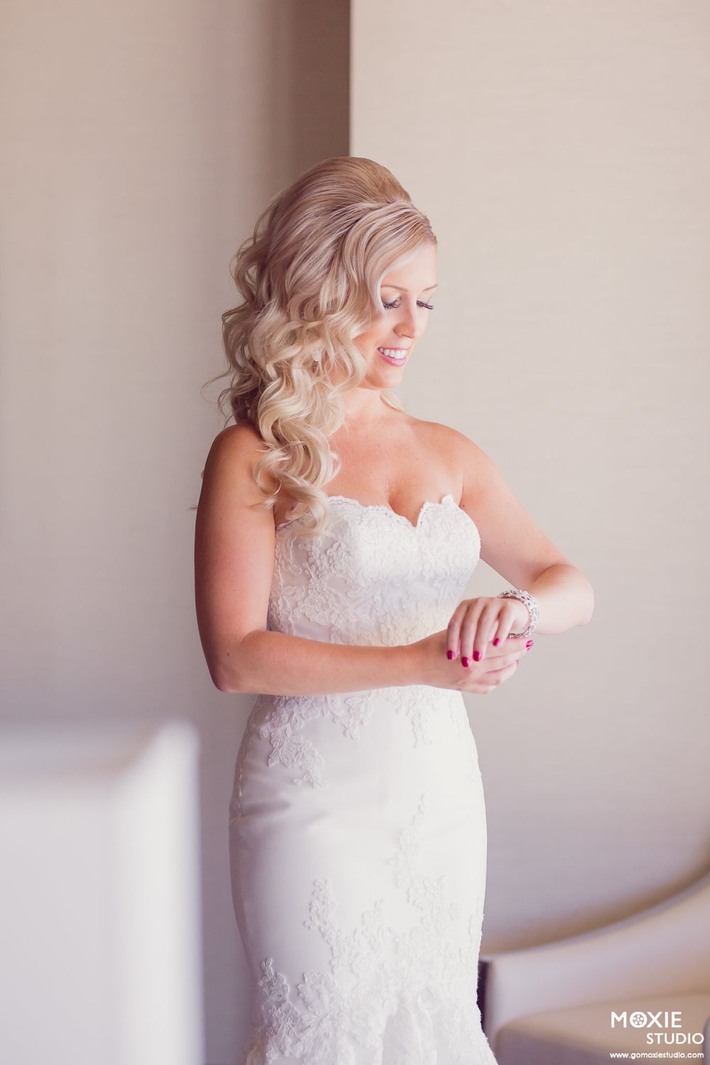 Elegant white lace wedding dress shown in sequence of photos displaying the delicate details and silhouette.