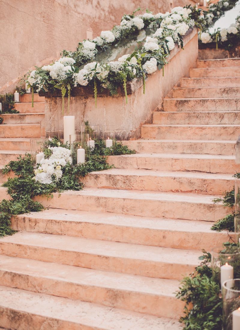 Floral Design at stairs at iconic wedding location Cap Rocat