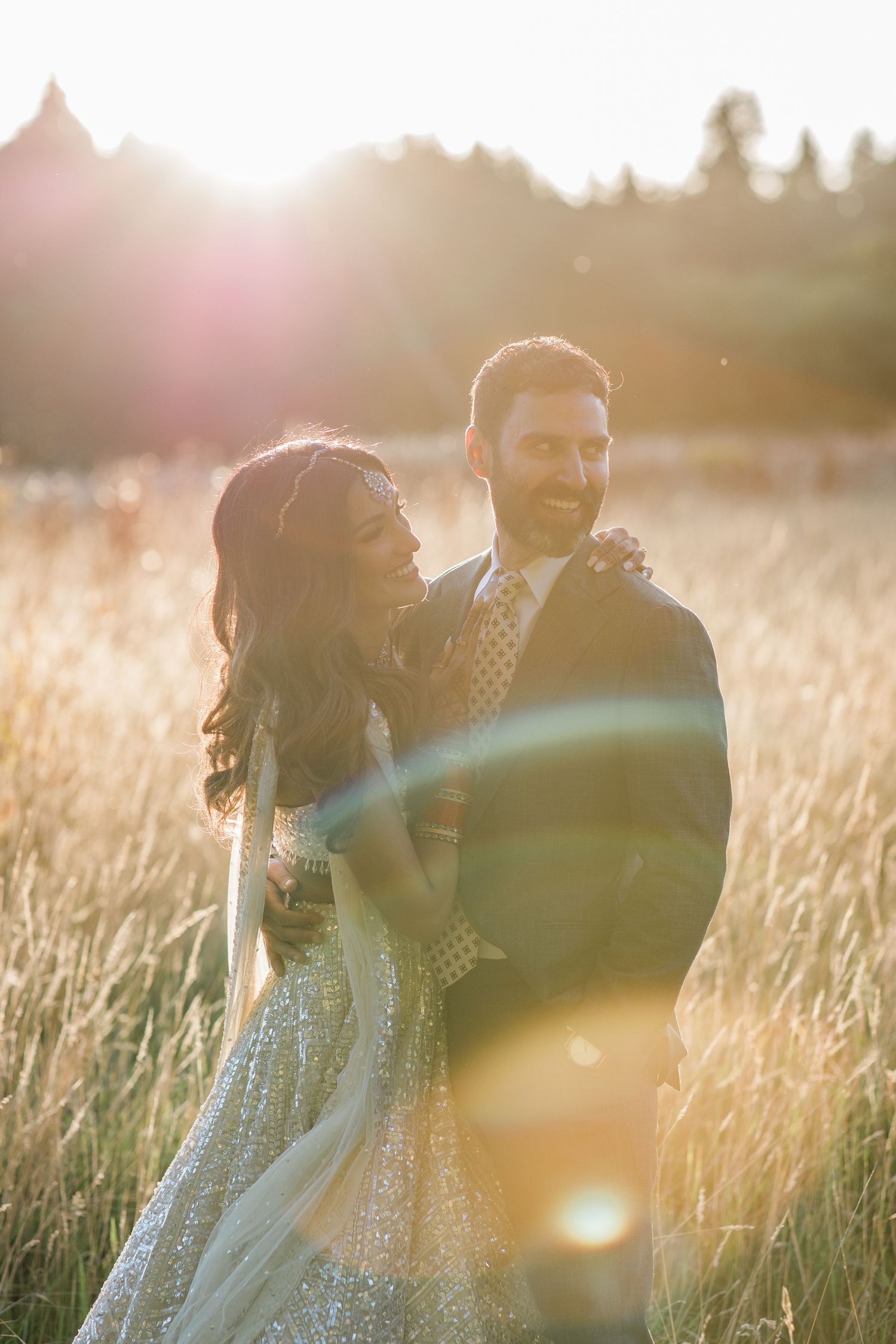 A Bride and Groom enjoying a moment during a stunning glowy golden hour at Northbrook Park, photographed by Maddie Waters Hampshire wedding