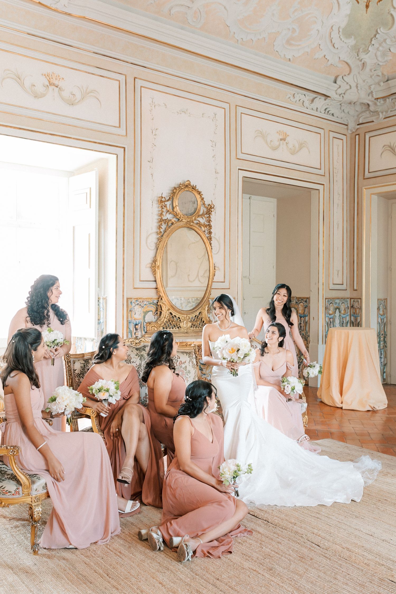 Indian bride and bridesmaids in pink at Palácio do Correio-Mor captured by Portugal wedding photographer