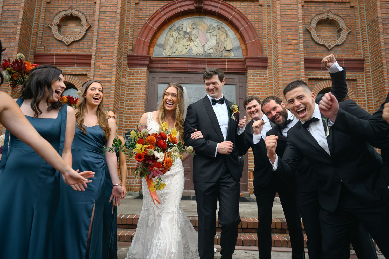 A joyful wedding ceremony processional with people walking down the church aisle in formal attire.