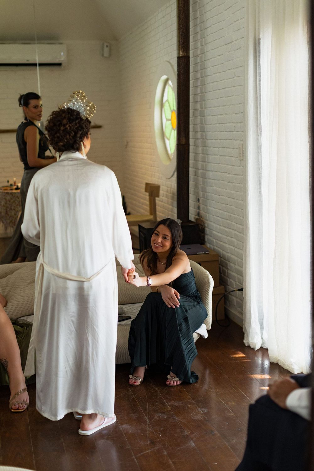 Interior scene with white brick walls showing wedding preparation moments.