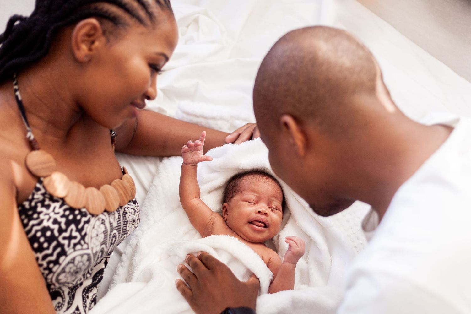 Intimate family moment captured in soft lighting with tender expressions.