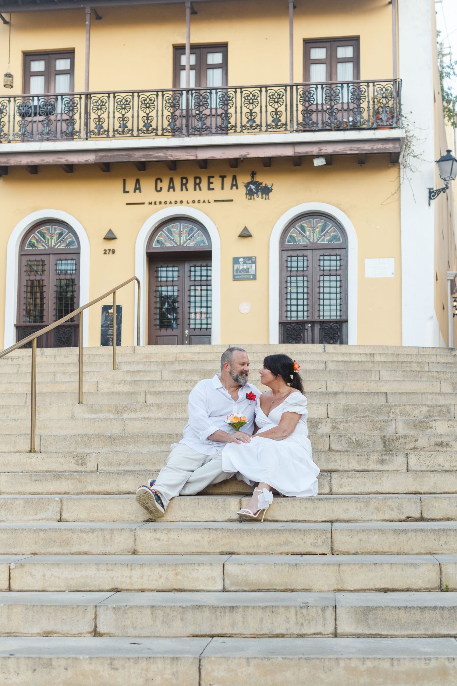 Wedding portrait. Seated on stairs in Old San Juan, Puerto Rico.