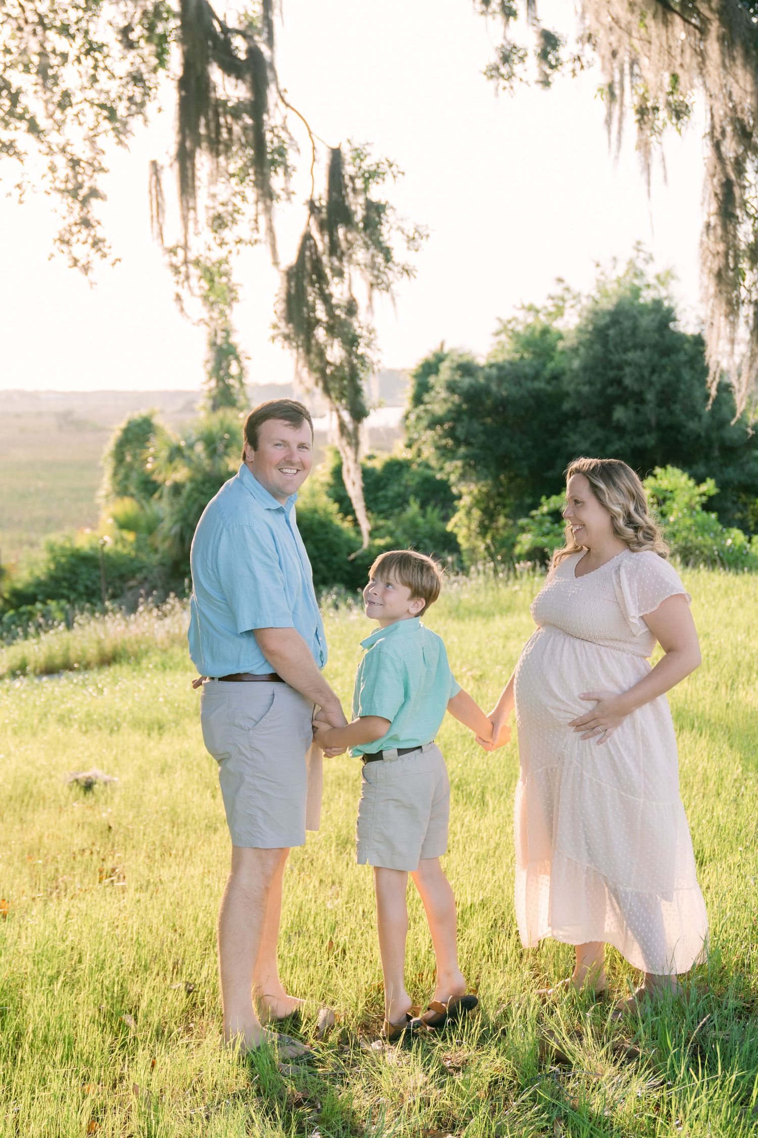 Golden hour maternity session near coastal marsh
